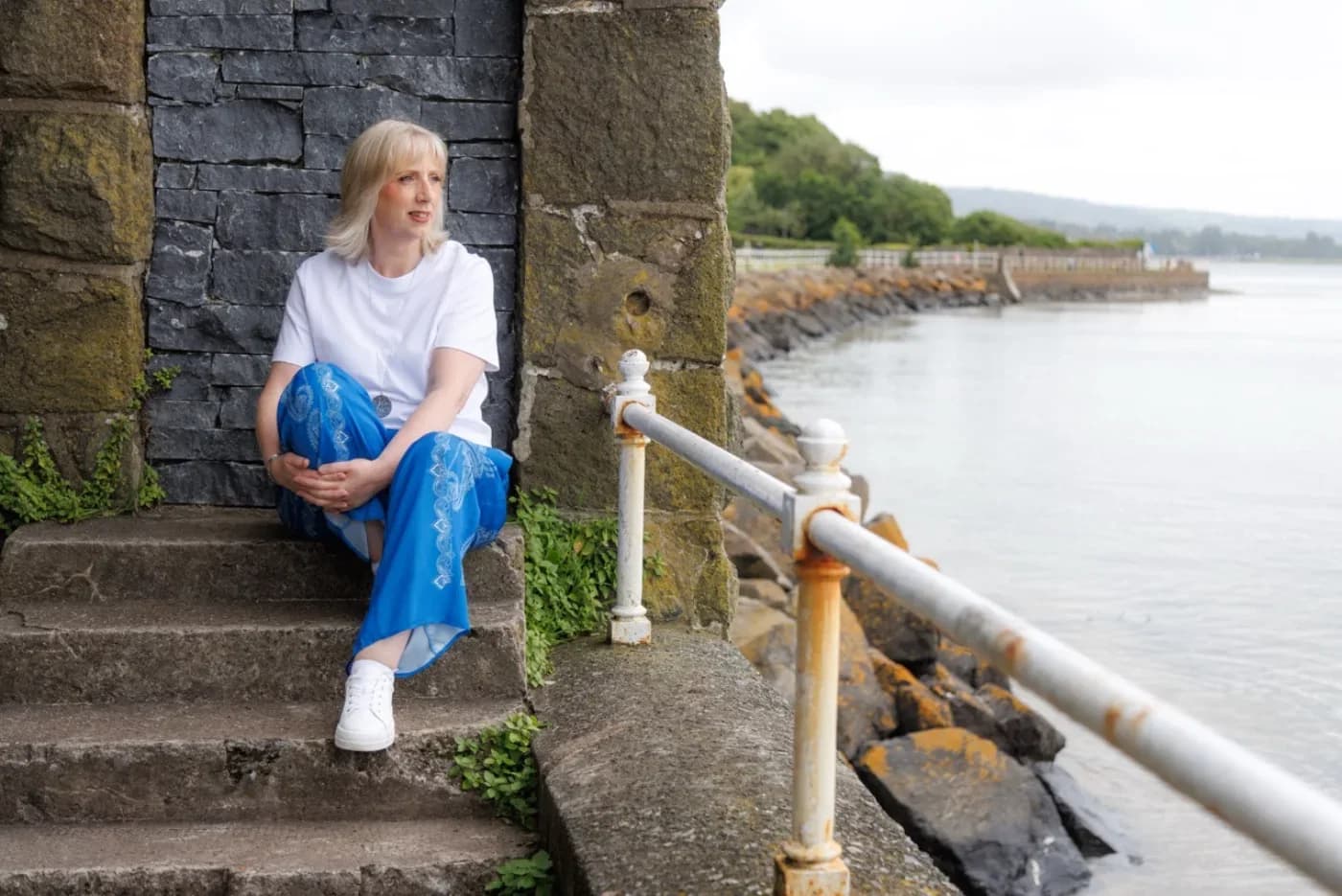 Amanda enjoying a quiet moment beside the coast