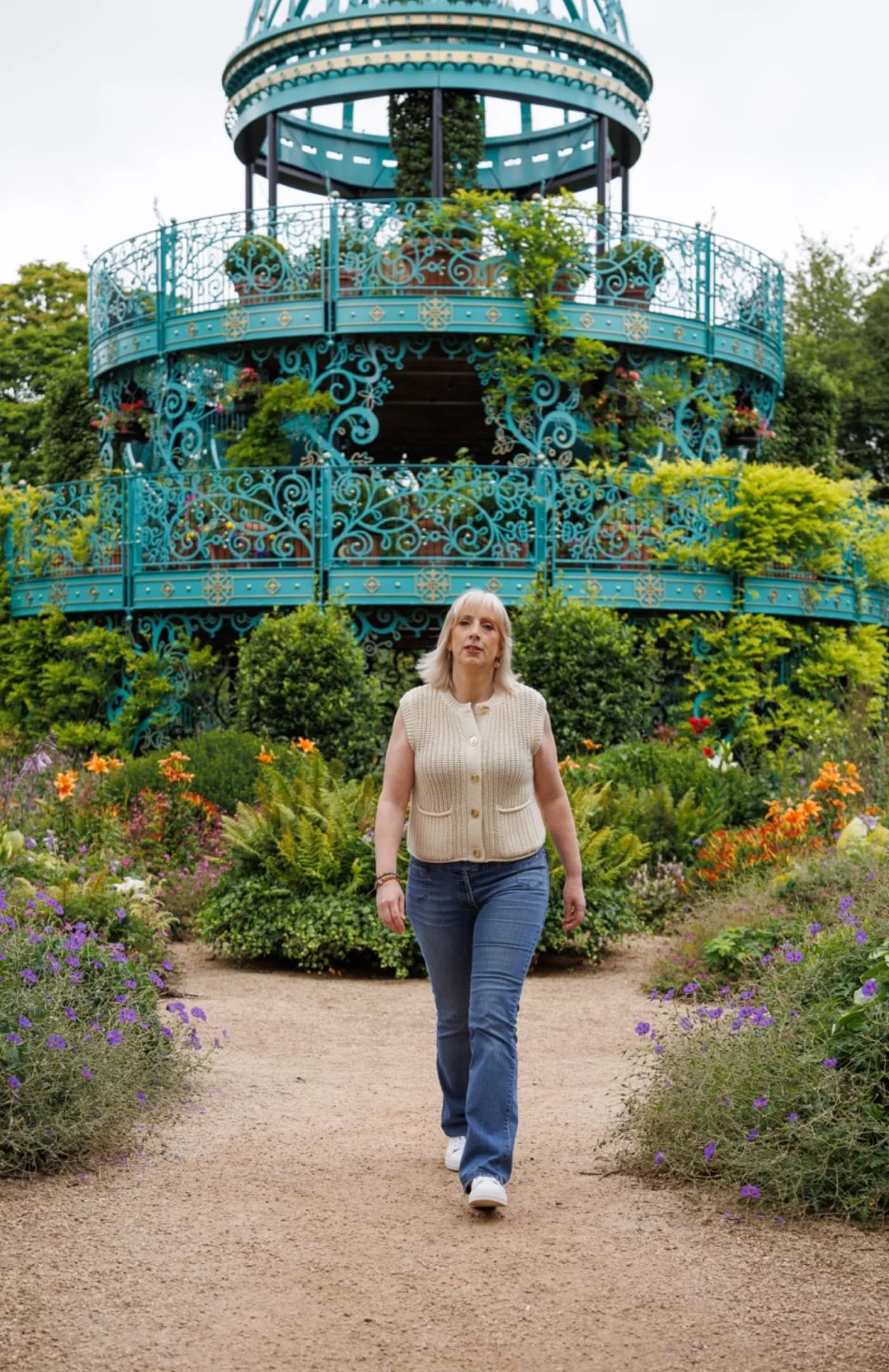 Amanda walking through a garden in Northern Ireland